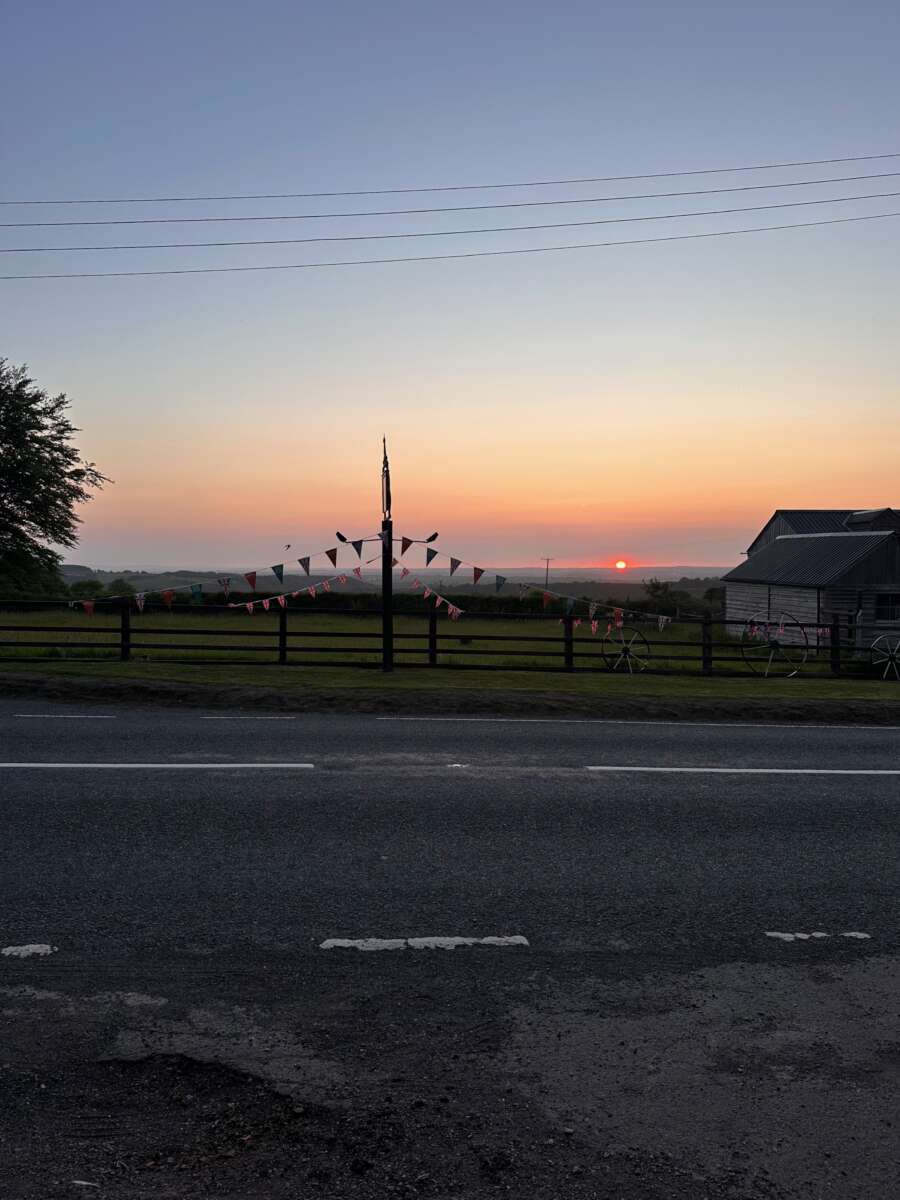 Land's End to John o'Groats - beautiful sunset with british flags